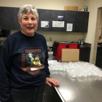Volunteer delivering a meal